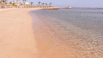 Beach umbrellas, beach towels, beach volleyball
