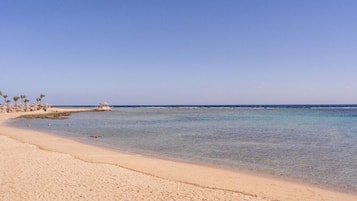 Para-sols per a la platja, tovalloles de platja i voleibol de platja