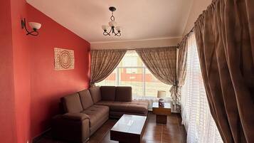 Suite Confort | Área de sala de estar