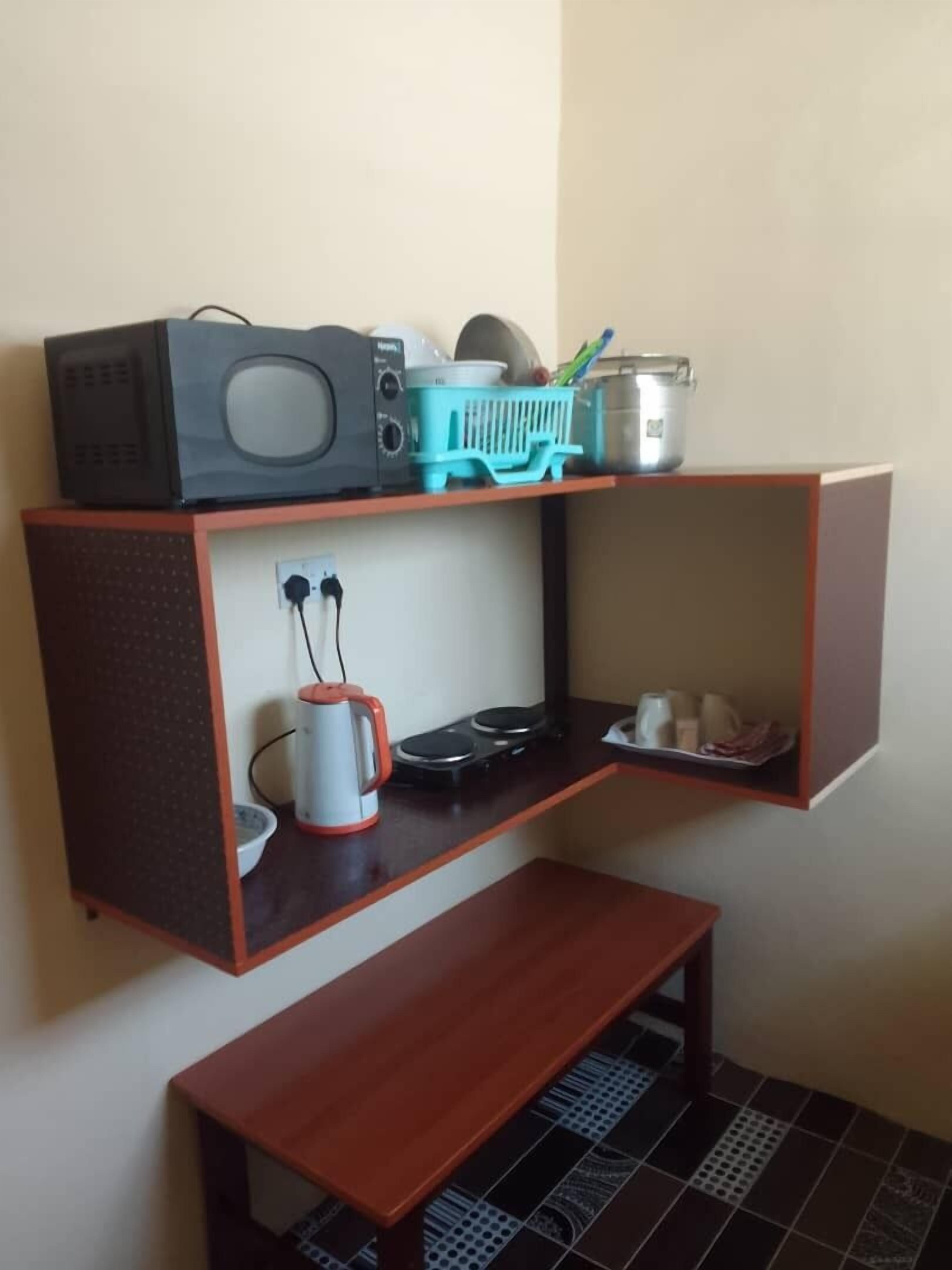Apartment, Balcony, City View | Private kitchen | Fridge, microwave, stovetop, cookware/dishes/utensils