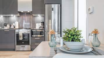 Suite – grand, byutsikt | Spiseområde på rommet