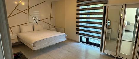 Family Apartment, Mountain View, Garden Area | Desk, iron/ironing board, free WiFi, bed sheets