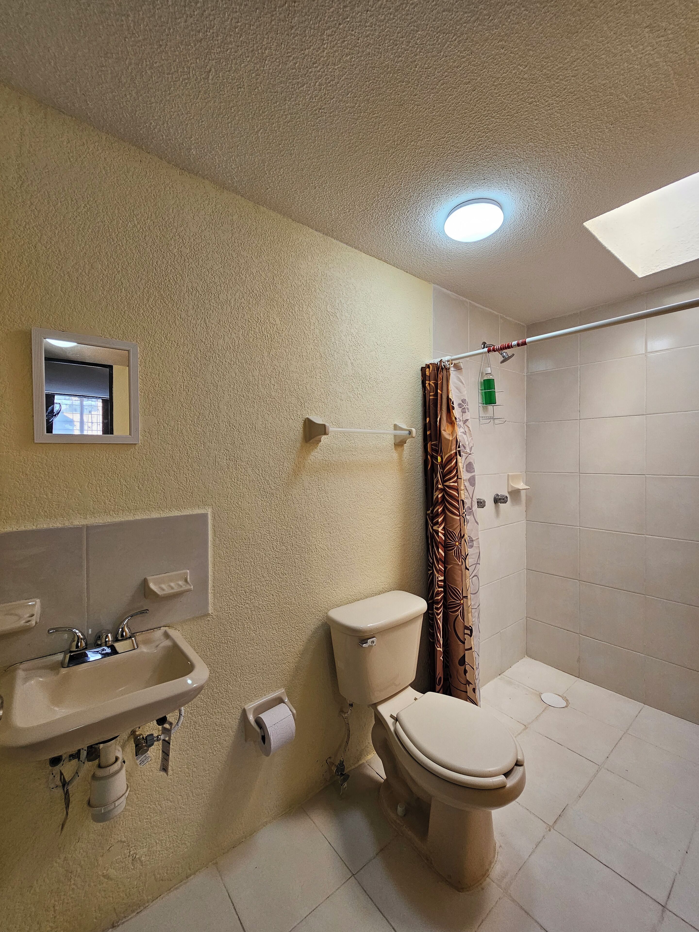 Shower, hair dryer, towels, toilet paper