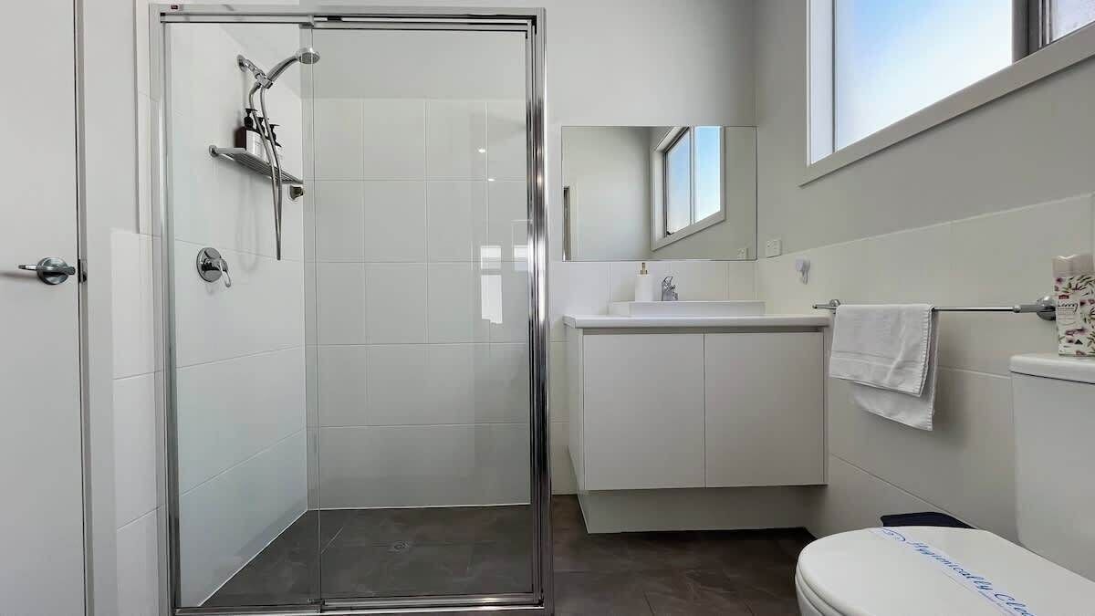 Shower, hair dryer, towels, shampoo
