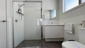 Shower, hair dryer, towels, shampoo