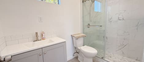Shower, hair dryer, towels, soap