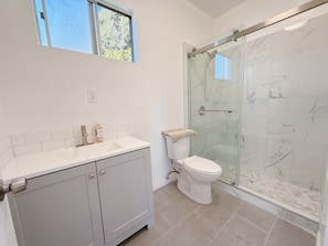 Shower, hair dryer, towels, soap