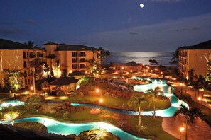 A resort with multiple swimming pools, a water slide, and beachfront views. - Waipouli Beach Oceanfront Resort (Kapaa)