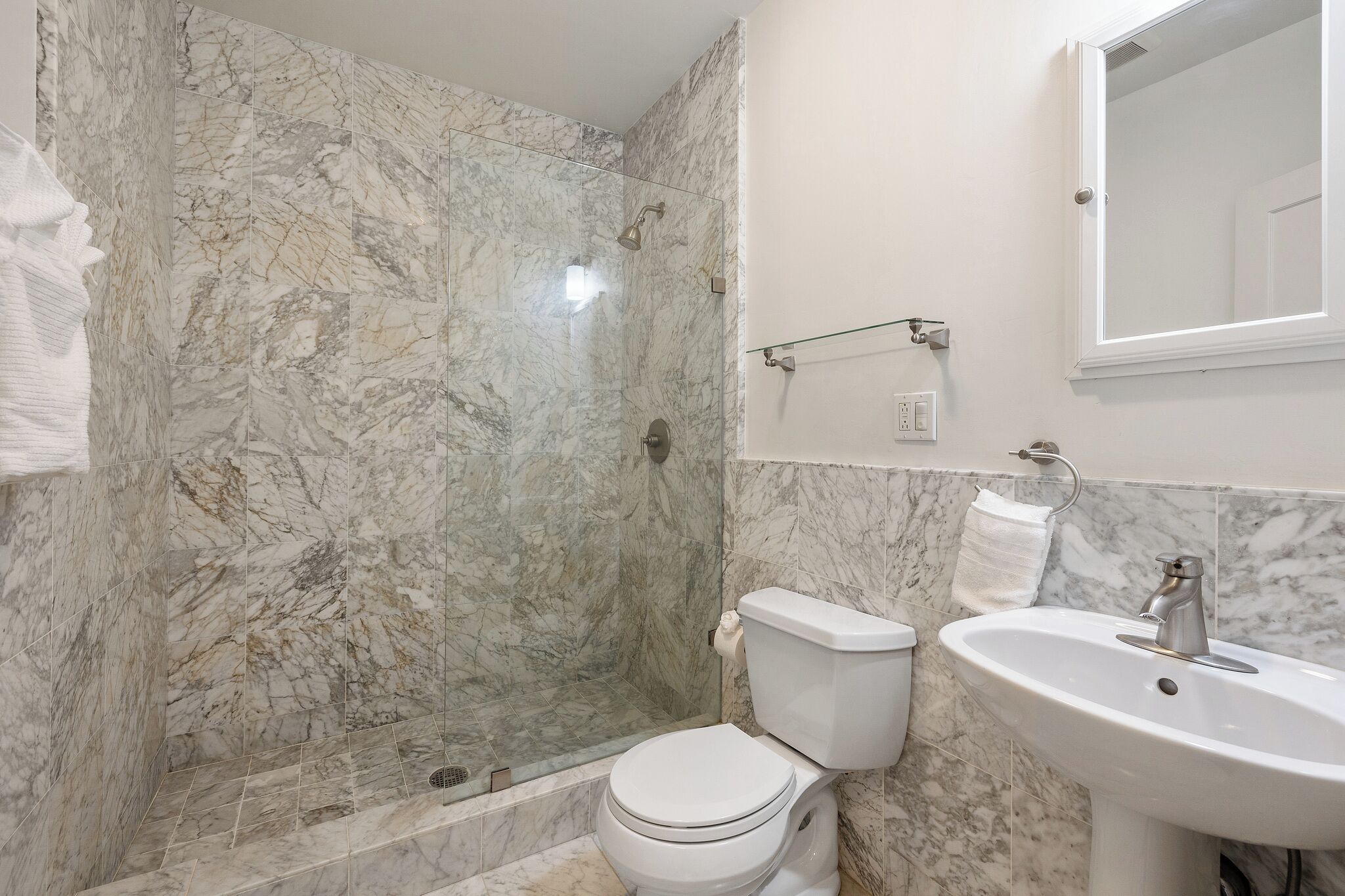 Shower, hair dryer, soap, toilet paper