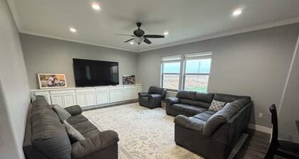 Peaceful 4-bedroom house near lake access with room for multiple boats.