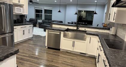 Peaceful 4-bedroom house near lake access with room for multiple boats.