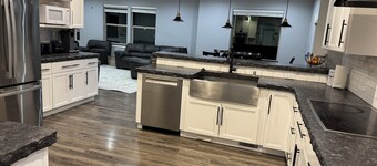 Peaceful 4-bedroom house near lake access with room for multiple boats.