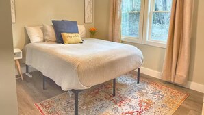 A bedroom with a bed, a ceiling fan, a window with curtains, and a rug. - 4 miles to Mercedes Benz Stadium-Sleeps 4-Best Value ATL STAY (Atlanta)