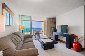 TV, books - Oceanfront Grand Venetian Condo • Private Balcony • Pools • Gym • Beach Access (Puerto Vallarta)