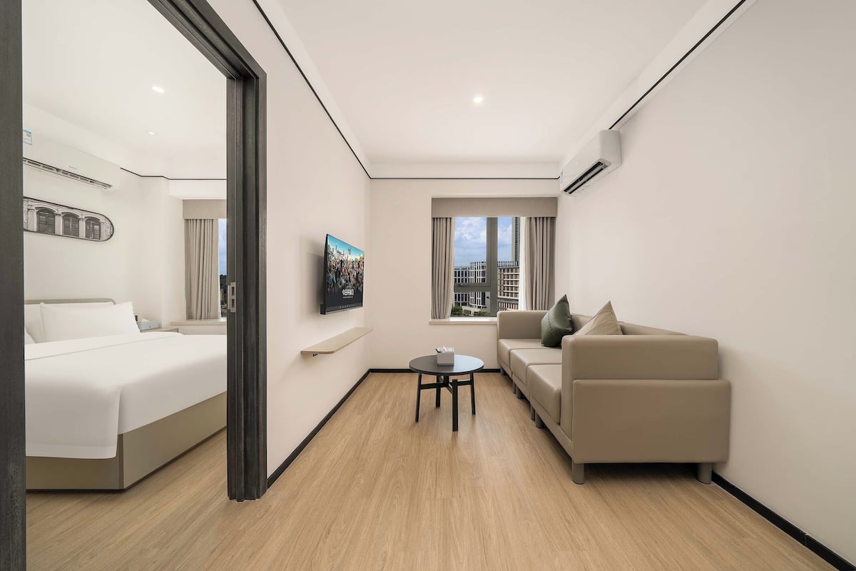 Panoramic Suite, City View | Desk, laptop workspace, blackout drapes, free WiFi