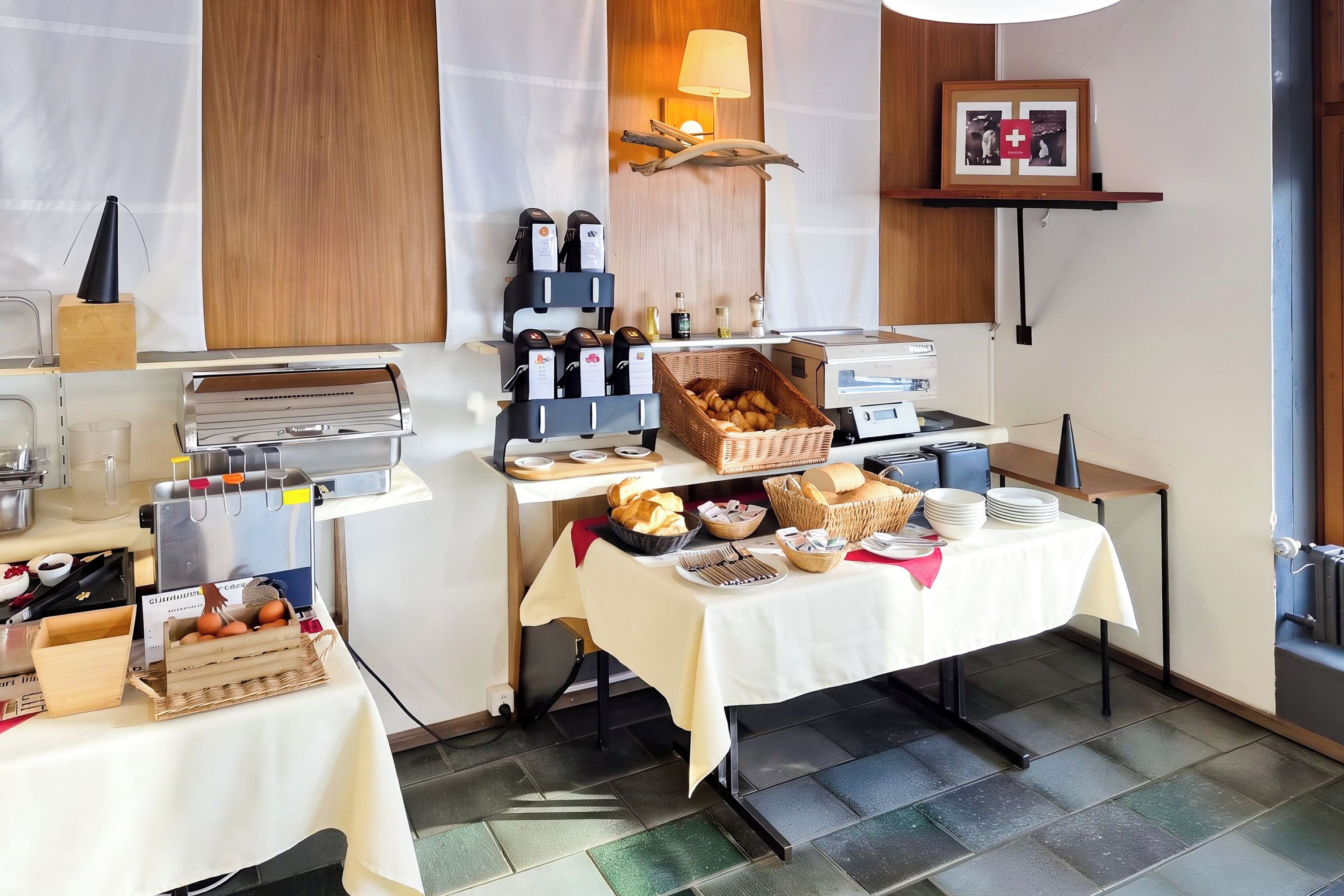 A breakfast buffet setup with various food items and a coffee station.