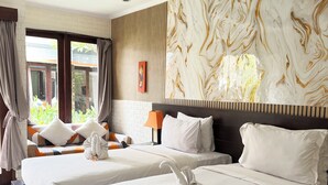 A hotel room with two beds, a marble-patterned wall, and a view of greenery outside. - 12 Bedroom Villa For Group (Badung)