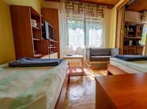 House (One Bedroom House With Terrace) | Living room | 32-inch flat-screen TV with cable channels - Holiday House Briški (Delnice)