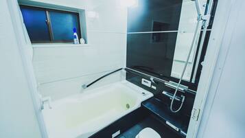 Hair dryer, towels, shampoo, toilet paper