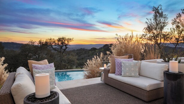 A patio with outdoor furniture, a pool, and a scenic view of trees and hills. - Secluded 4BDR Retreat w/ Pool, Hot Tub, Views | Shiloh Vista Estate by AvantStay (Santa Rosa)