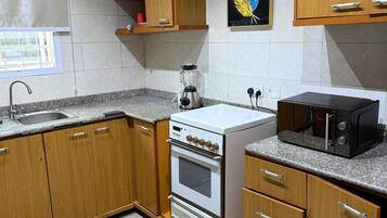 Appartement Deluxe, balcon, vue ville | Cuisine privée