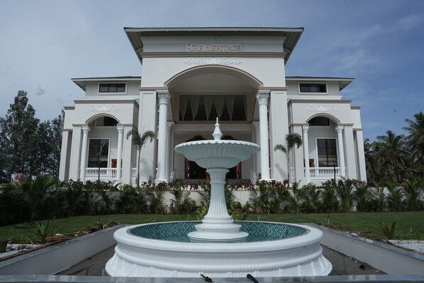 A building with a large fountain in front, named "The Heritage."