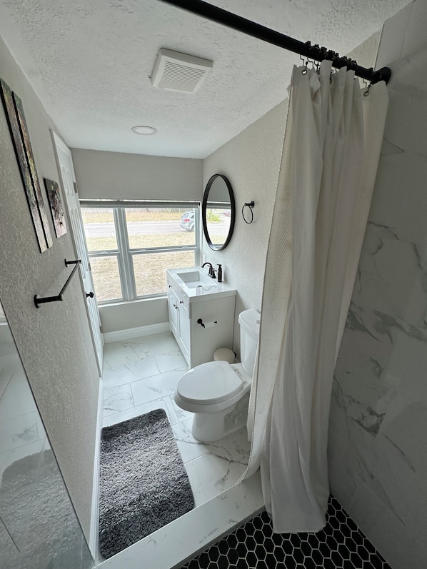 Shower, towels, toilet paper