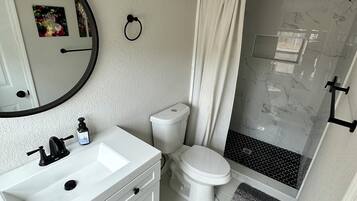 Shower, towels, toilet paper