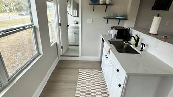 Fridge, microwave, stovetop, coffee/tea maker