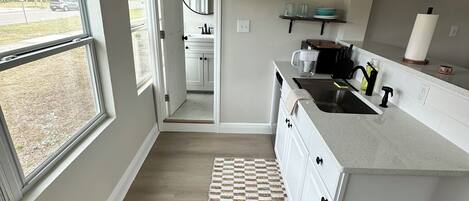 Fridge, microwave, stovetop, coffee/tea maker