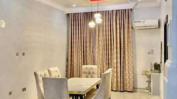 Economy Apartment, Balcony, City View | Dining room