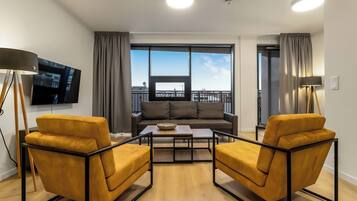 Comfort Apartment | Living area | Flat-screen TV