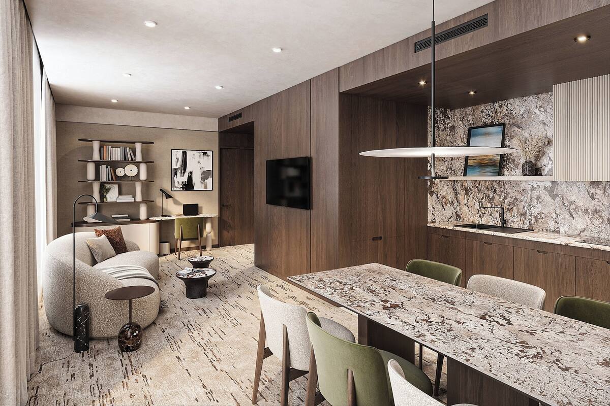 A modern interior with a dining area, a sofa, a TV, and a bookshelf.