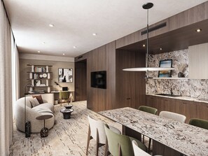 Suite Deluxe, plusieurs lits | Coin séjour