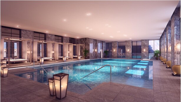 A modern indoor swimming pool with seating areas and lighting. - Pullman Ninh Binh (Ninh Binh)