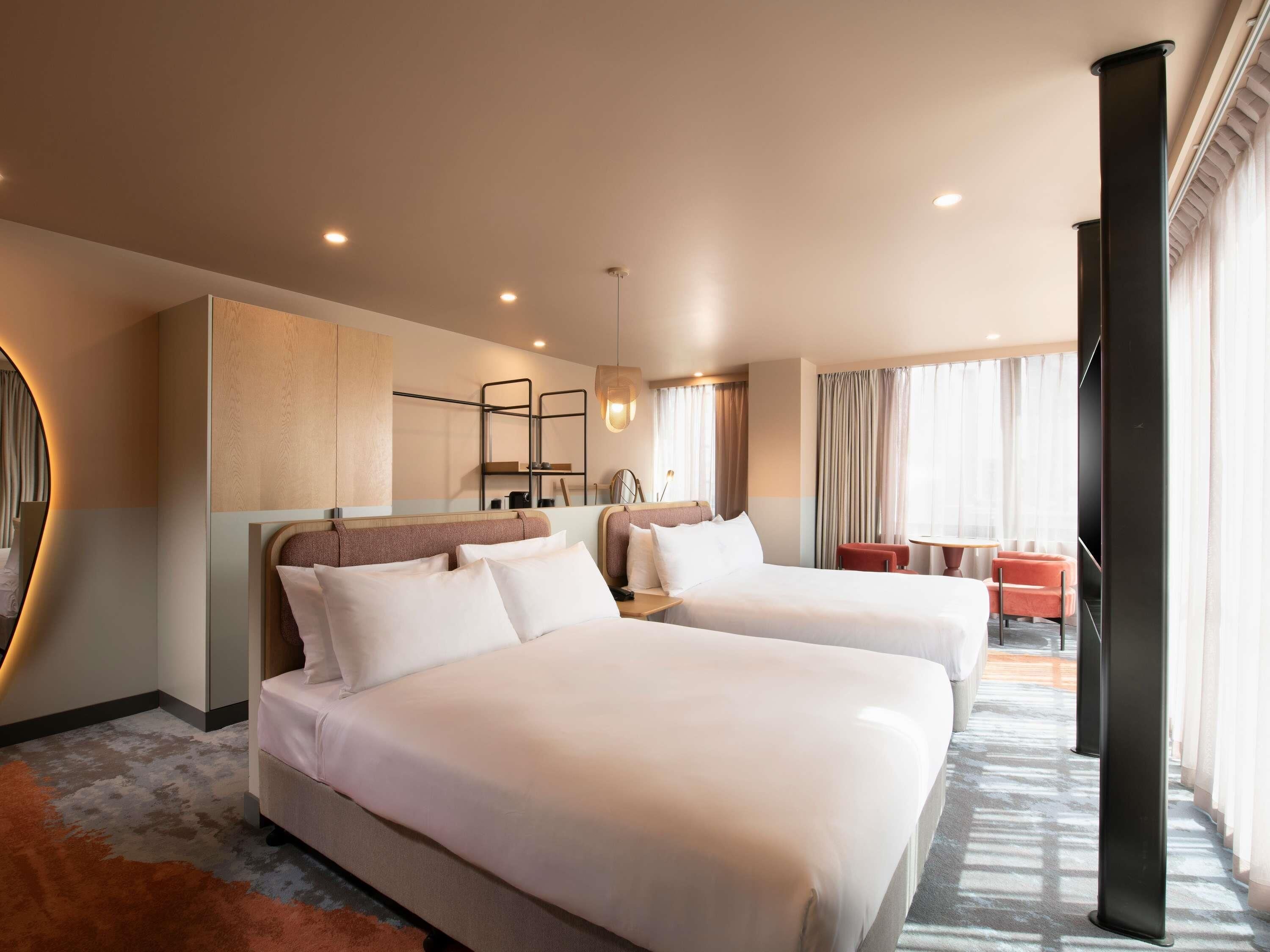 Junior Suite, 2 Double Beds | In-room safe, laptop workspace, blackout drapes, iron/ironing board