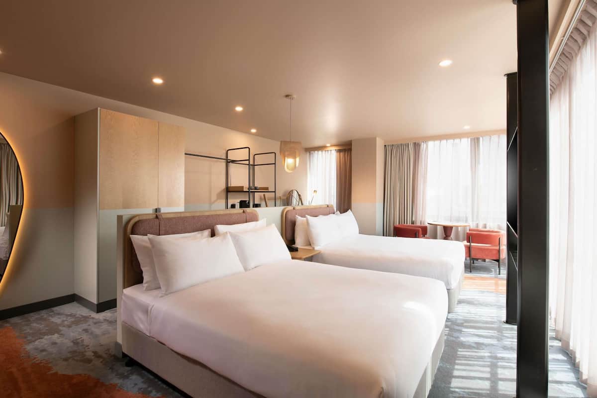 Junior Suite, 2 Double Beds | In-room safe, laptop workspace, blackout drapes, iron/ironing board