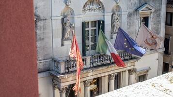 A building facade with classical architecture, including statues and columns.