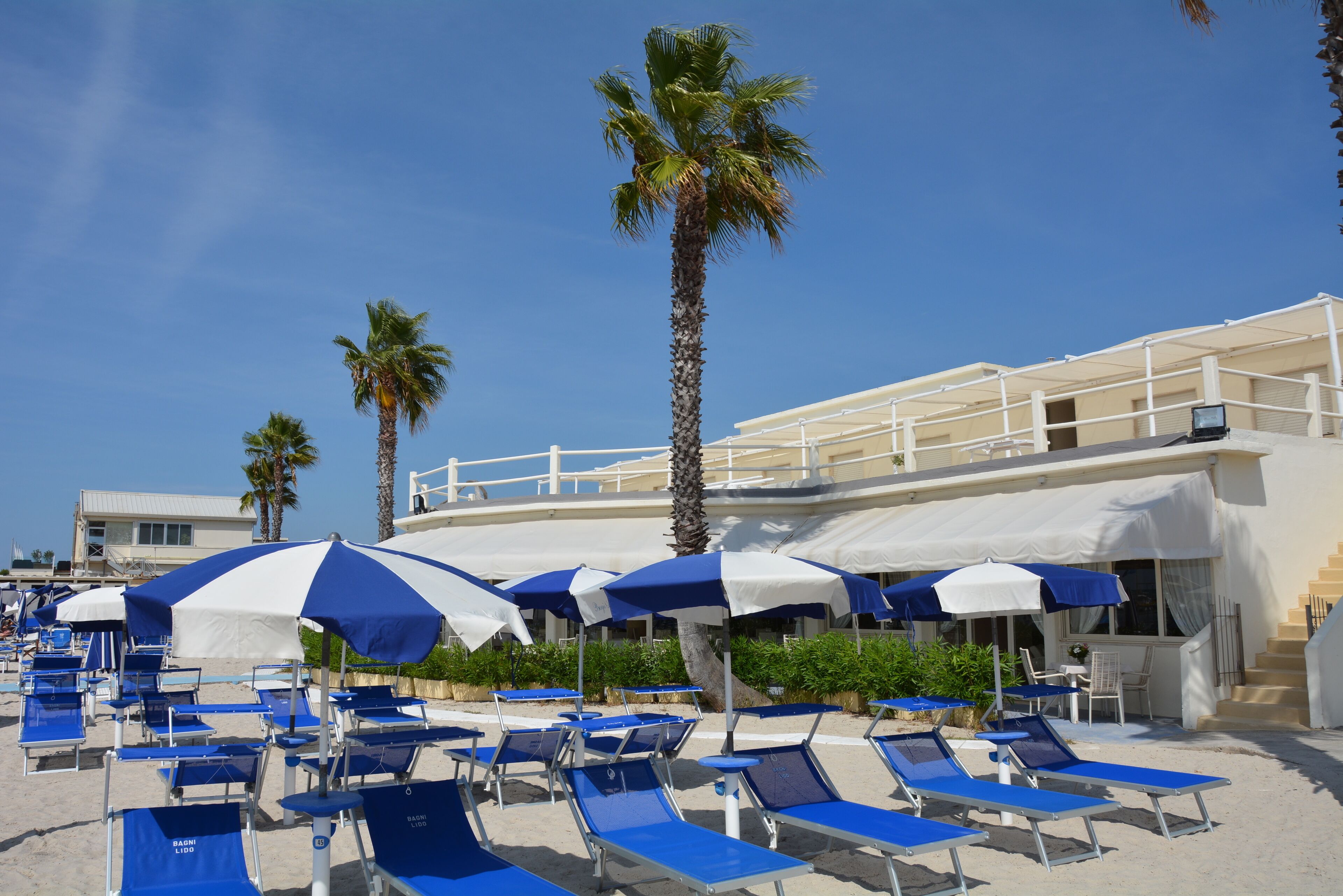 Private beach, white sand, sun-loungers, beach umbrellas
