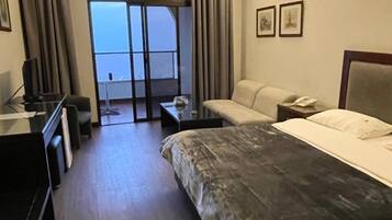 Deluxe Room, Balcony, Sea View | In-room safe, blackout drapes, iron/ironing board, free WiFi