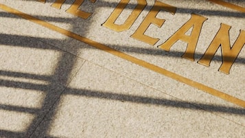 A stone floor with the words "THE DEAN" engraved in gold lettering.