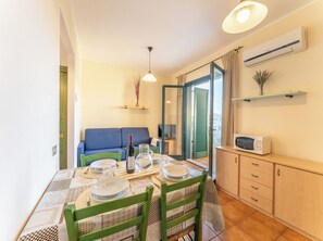 Apartment, 1 Bedroom, Balcony, Pool View | Dining room - Charming House Near Rena Bianca Beach (Santa Teresa di Gallura)
