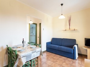 Apartment, 1 Bedroom, Balcony, Pool View | Living room - Charming House Near Rena Bianca Beach (Santa Teresa di Gallura)