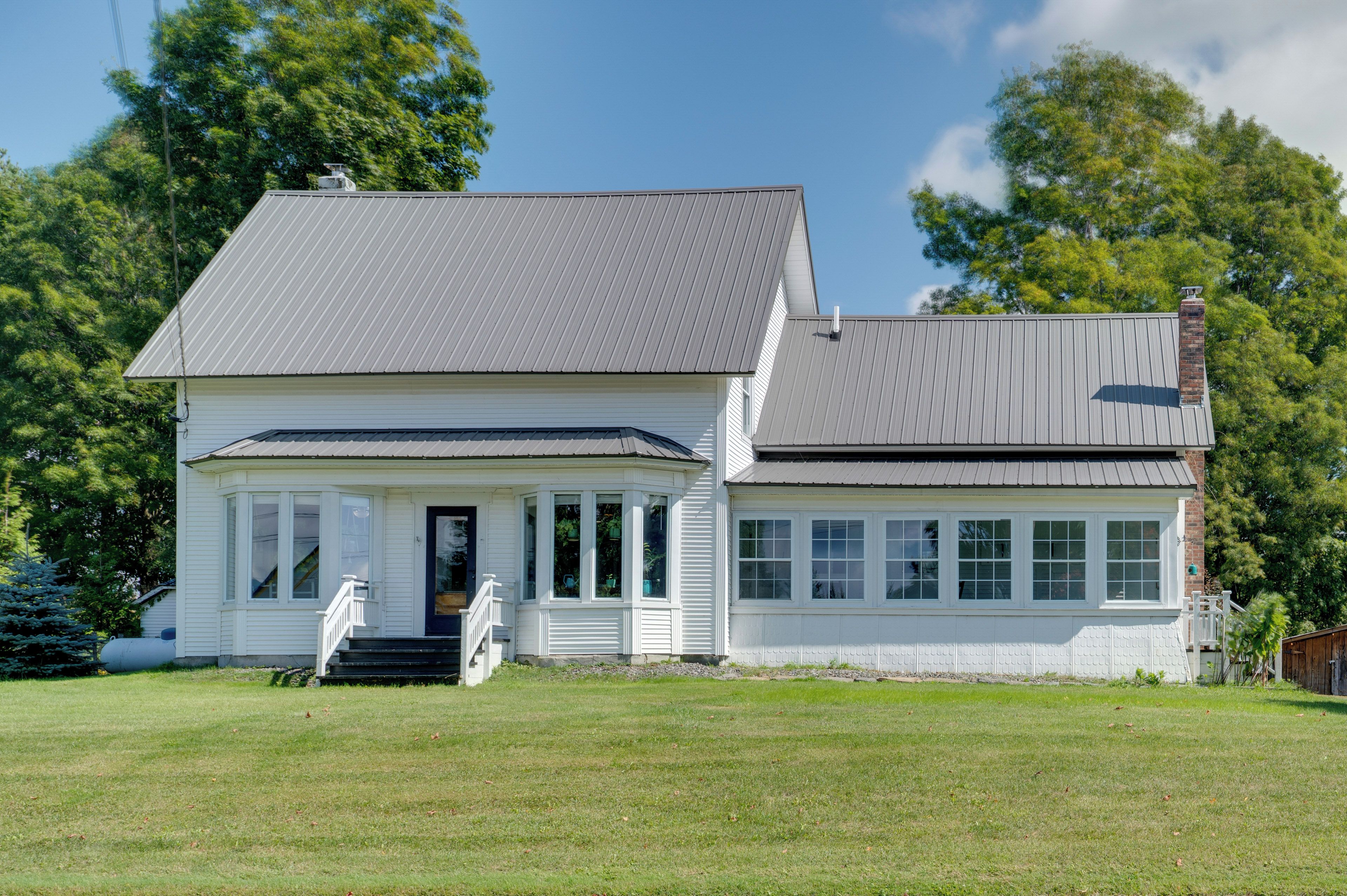A two-story house with a front porch and a garage.