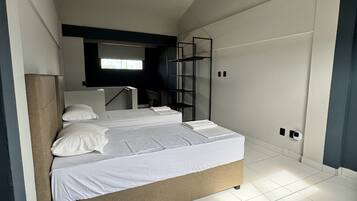 Desk, laptop workspace, blackout drapes, iron/ironing board