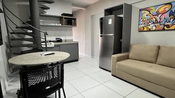 Desk, laptop workspace, blackout drapes, iron/ironing board