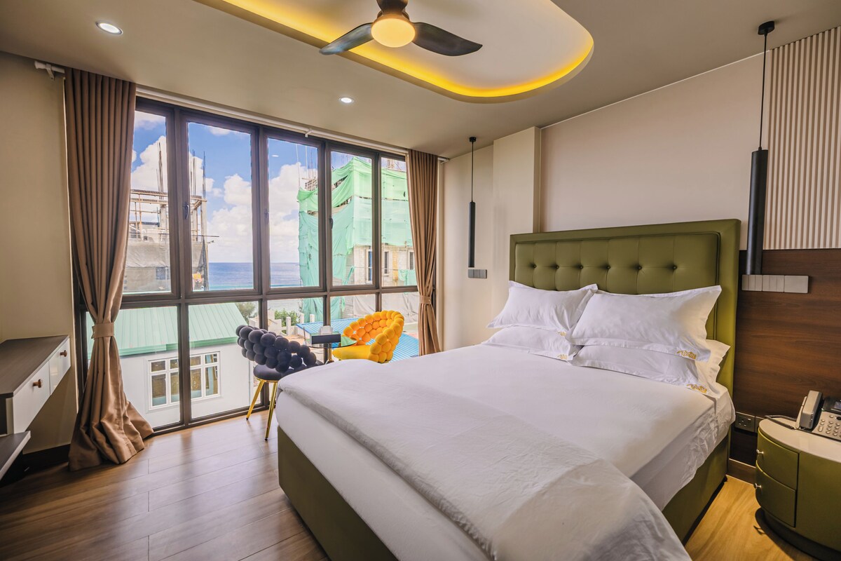 Habitación Deluxe, vista al mar | Sábanas de algodón egipcio y ropa de cama de alta calidad 