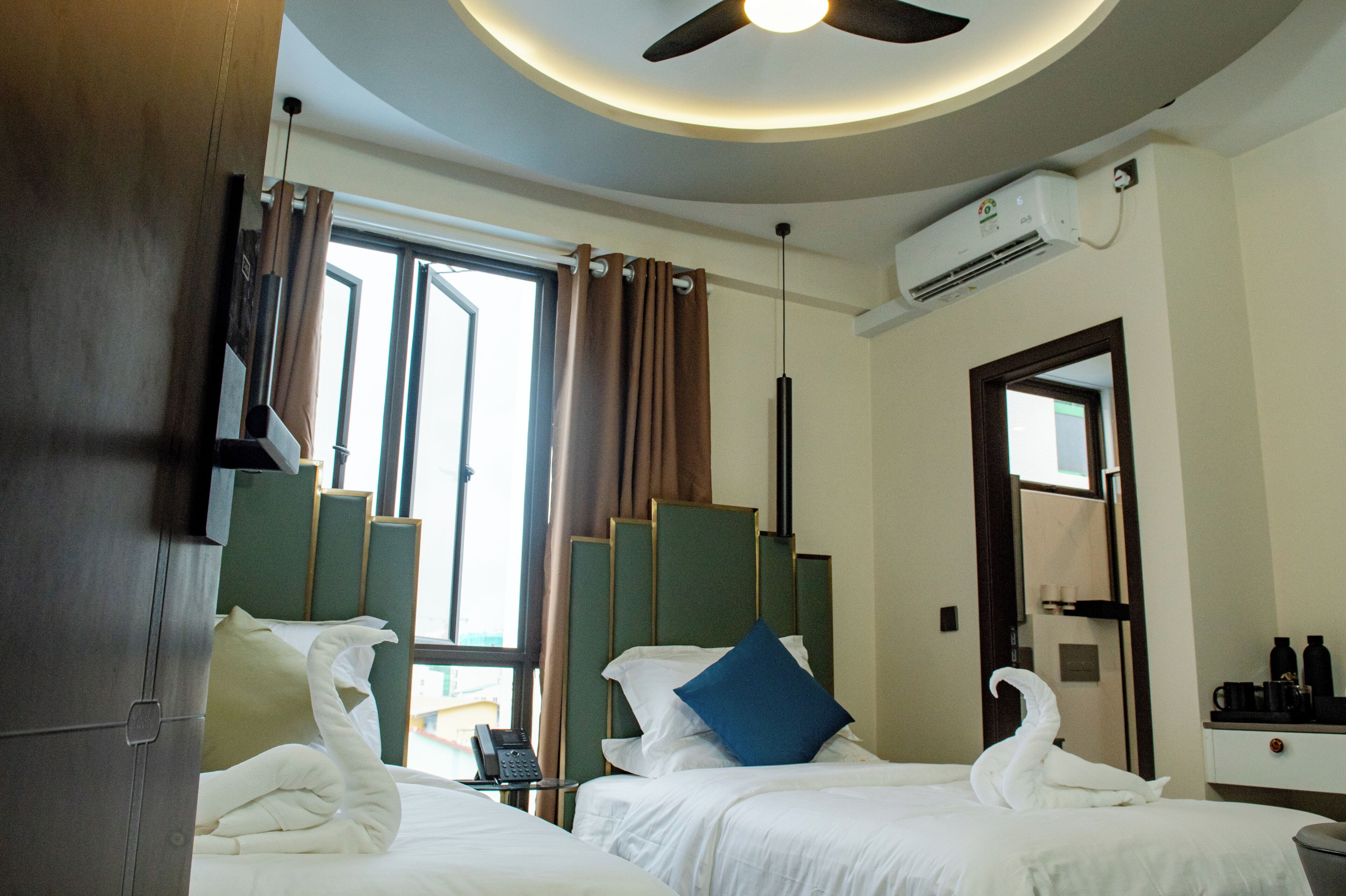 Double or Twin Room, City View | In-room safe, desk, laptop workspace, iron/ironing board