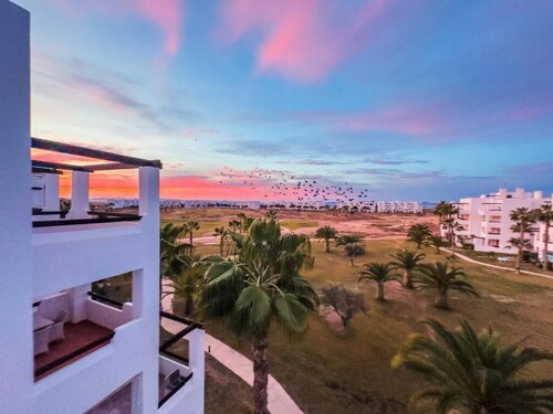 Sun-facing penthouse with pool and stunning golf course views