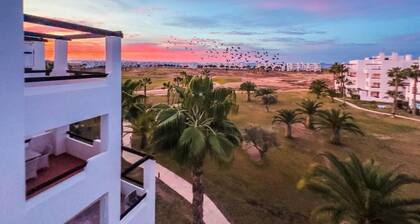 Sun-facing penthouse with pool and stunning golf course views